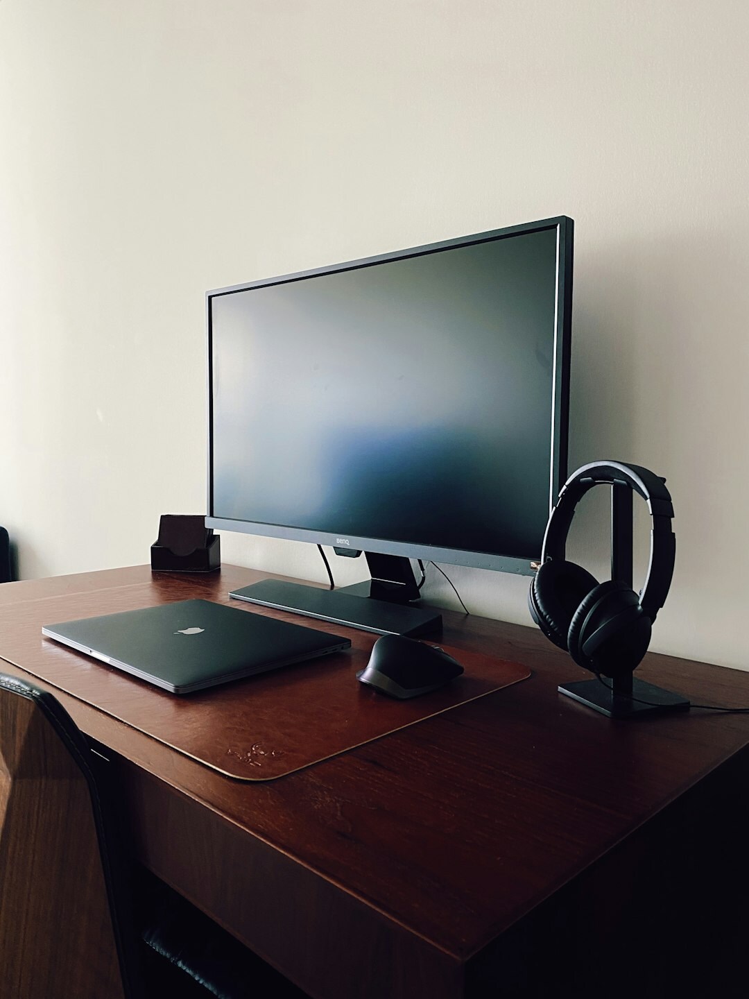 Desk with computer and headphones